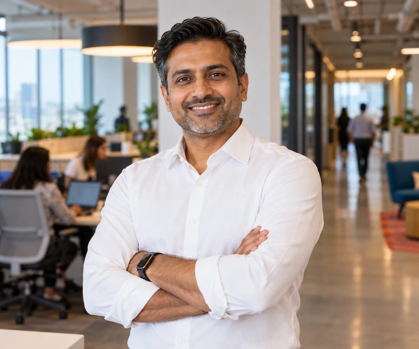 A consulting leader standing in a modern open plan office